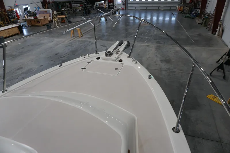 Slide: The Image of 2006 Back Cove 29 boat deck in a spacious indoor workshop. - 31