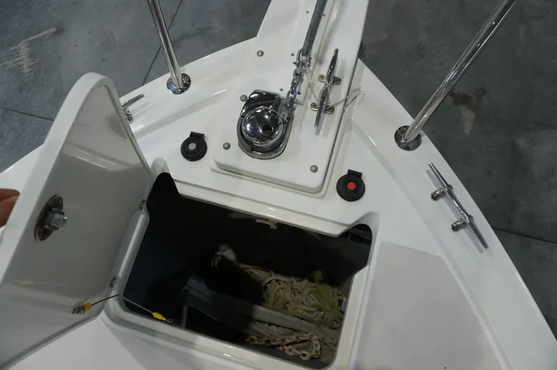 Slide: The Image of 2006 Back Cove 29 boat anchor locker with open hatch and visible anchor chain. - 32