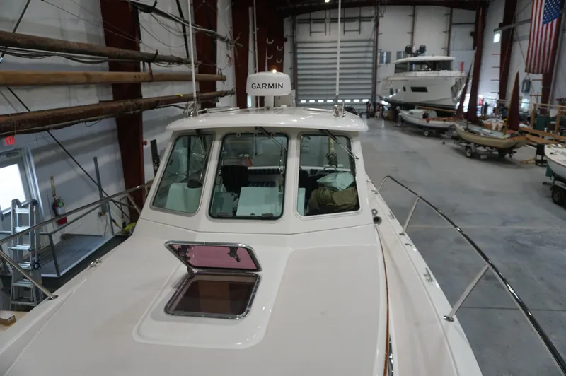 Slide: The Image of 2006 Back Cove 29 boat in a large indoor storage facility. - 33
