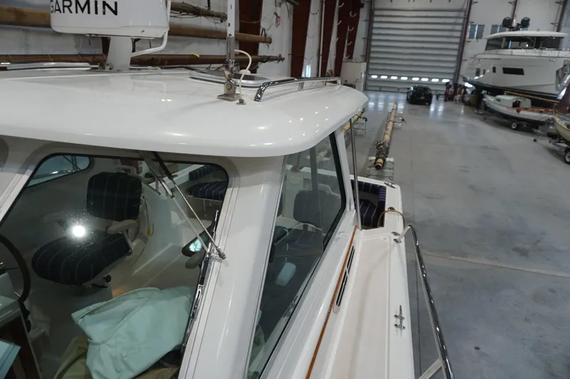 Slide: The Image of 2006 Back Cove 29 boat in storage facility, featuring Garmin equipment. - 36