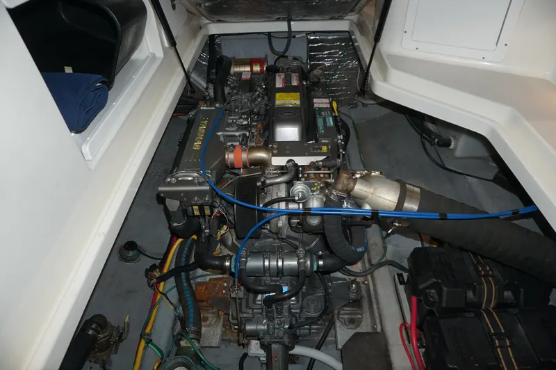 Slide: The Image of Engine compartment of a 2006 Back Cove 29 boat, showcasing detailed mechanical components. - 41