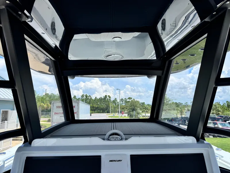 Slide: The Image of Interior view of 2026 Invincible 38 Catamaran cockpit with modern design and clear sky. - 19