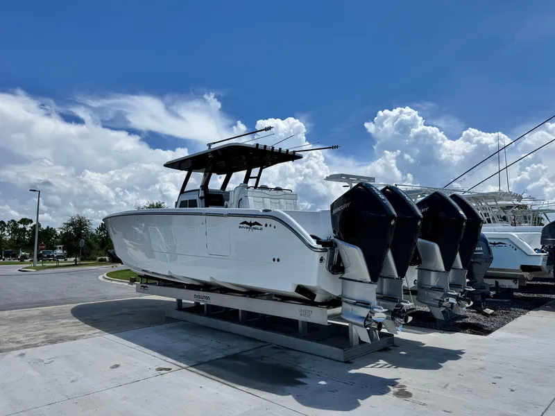 Slide: The Image of 2026 Invincible 38 Catamaran with dual outboard engines on display under a clear blue sky. - 3
