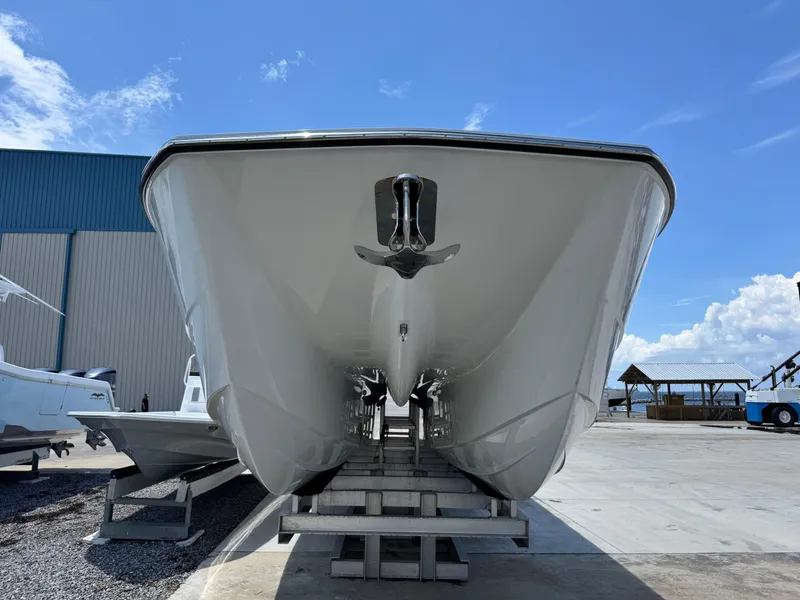 Slide: The Image of 2026 Invincible 38 Catamaran on dry dock under clear blue sky. - 6
