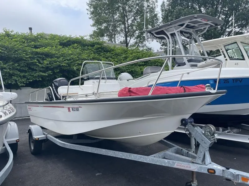 Slide: The Image of 2008 Boston Whaler 170 Montauk boat on trailer, parked outdoors. - 1