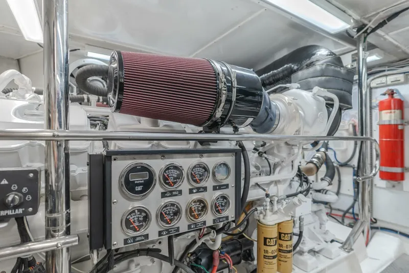 Slide: The Image of Engine room of 2001 Mikelson 61 Yachtfisher with gauges and filters visible. - 106