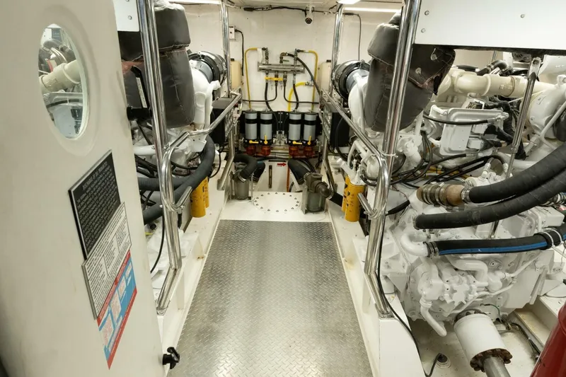 Slide: The Image of Engine room of 2001 Mikelson 61 Yachtfisher, showcasing machinery and equipment. - 107