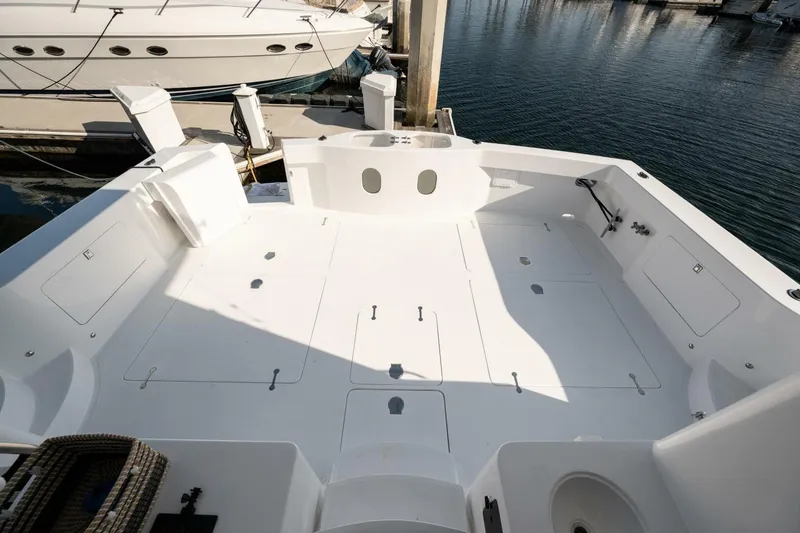 Slide: The Image of Spacious deck of 2001 Mikelson 61 Yachtfisher, docked at marina. - 114