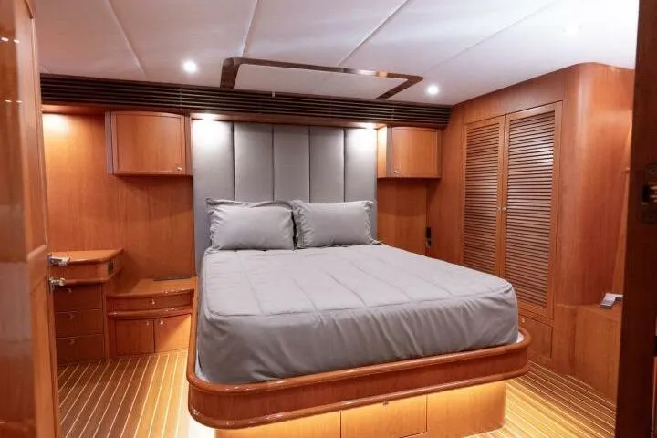 Slide: The Image of Luxurious bedroom interior of 2001 Mikelson 61 Yachtfisher with wood accents and modern design. - 63
