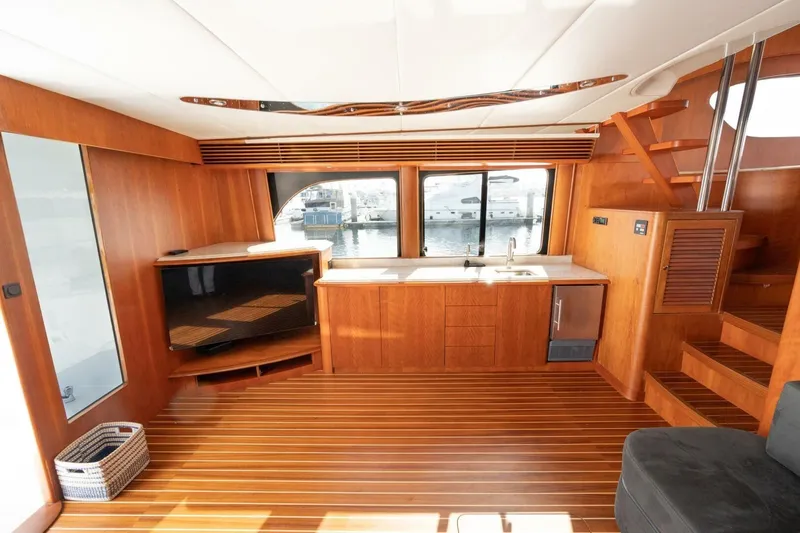 Slide: The Image of Luxurious interior of 2001 Mikelson 61 Yachtfisher with wood finish and modern amenities. - 67