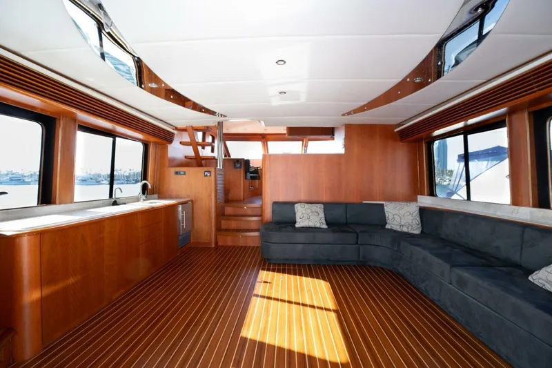Slide: The Image of Luxurious interior of 2001 Mikelson 61 Yachtfisher with wood flooring and spacious seating. - 69