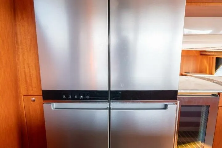 Slide: The Image of Stainless steel refrigerator in 2001 Mikelson 61 Yachtfisher interior. - 76