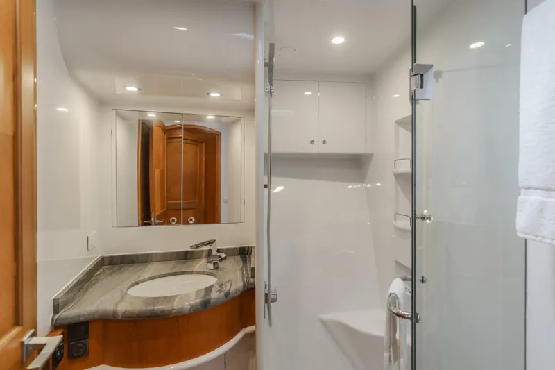 Slide: The Image of Luxurious bathroom in 2001 Mikelson 61 Yachtfisher with modern fixtures and elegant design. - 90