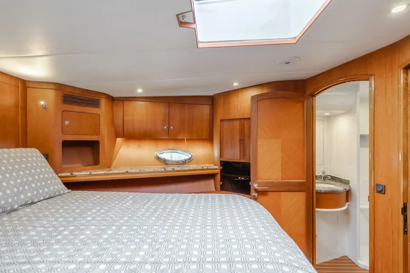 Slide: The Image of Luxurious cabin interior of 2001 Mikelson 61 Yachtfisher with wood finishes and ensuite bathroom. - 94