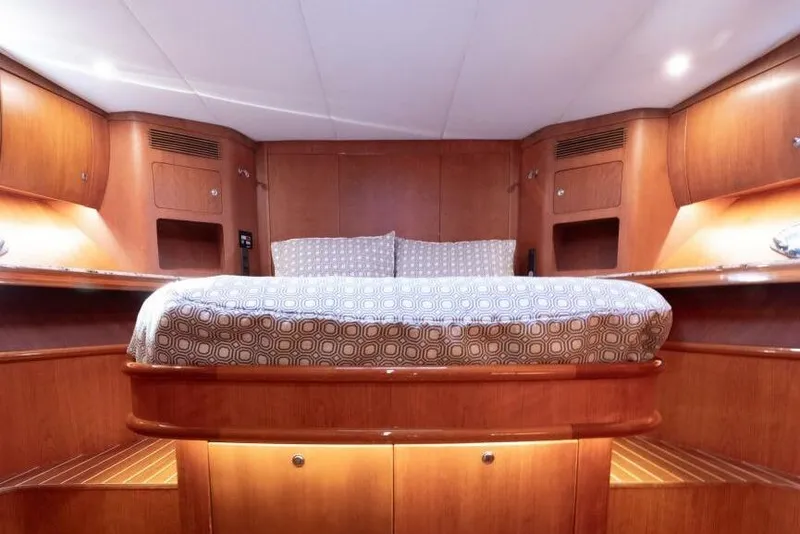 Slide: The Image of Luxurious cabin interior of 2001 Mikelson 61 Yachtfisher with elegant wood finish. - 97