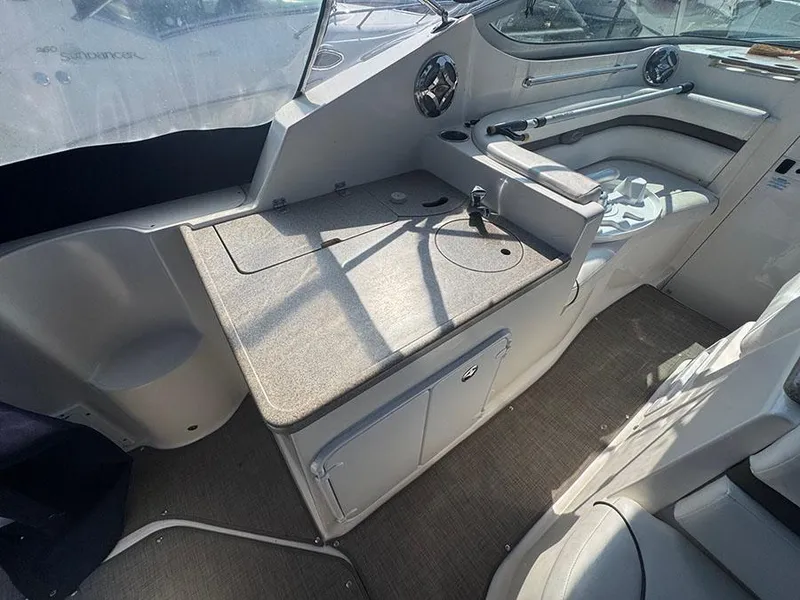 Slide: The Image of 2008 Rinker 280 Express Cruiser interior with helm and seating area. - 8