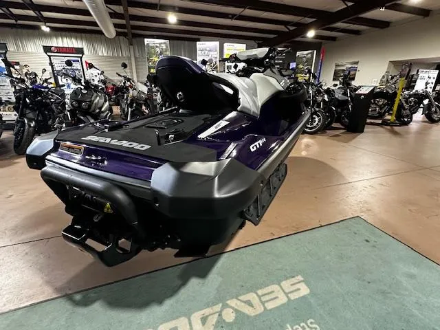 Slide: The Image of 2025 Sea-Doo GTI SE 130 W/ Audio jet ski displayed in showroom. - 11