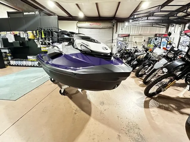 Slide: The Image of 2025 Sea-Doo GTI SE 130 with Audio, displayed in a showroom with motorcycles. - 3