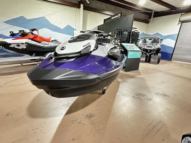 Slide: The Image of 2025 Sea-Doo GTI SE 130 with Audio, displayed in a showroom with other vehicles. - 5