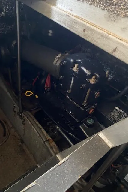 Slide: The Image of Engine compartment of a 1999 Silverton 392 Motor Yacht, showcasing mechanical components. - 19