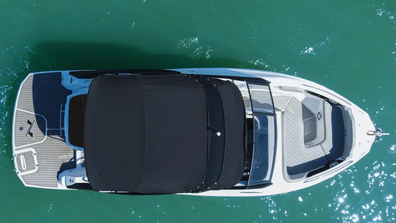 Slide: The Image of Overhead view of 2025 NX Boats NX260 EVOLUTION on turquoise water. - 4