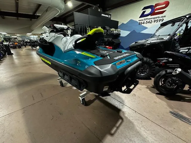 Slide: The Image of 2025 Sea-Doo GTI SE 170 jet ski displayed in showroom, featuring sleek design and vibrant colors. - 12