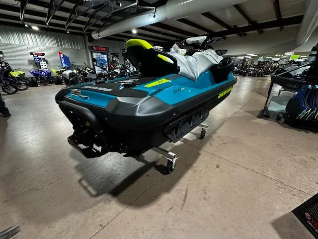 Slide: The Image of 2025 Sea-Doo GTI SE 170 jet ski displayed in a showroom setting. - 14