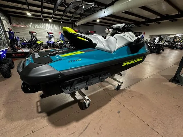 Slide: The Image of 2025 Sea-Doo GTI SE 170 jet ski displayed in showroom, vibrant blue and black design. - 15