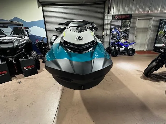 Slide: The Image of 2025 Sea-Doo GTI SE 170 jet ski displayed in showroom with Yamaha vehicles. - 7