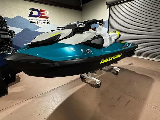 Slide: The Image of 2025 Sea-Doo GTI SE 170 jet ski displayed indoors on a stand. - 9