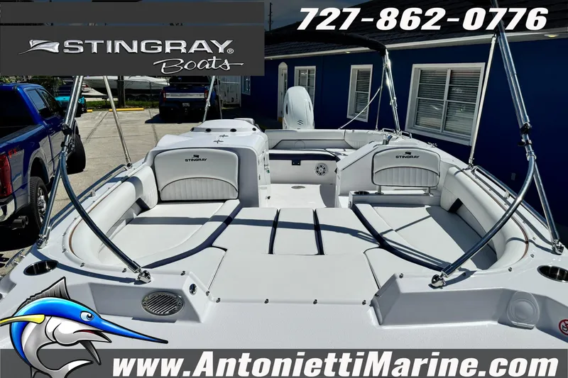 Slide: The Image of 2026 Stingray 212 SC boat interior at Antonietti Marine dealership, featuring spacious seating. - 17