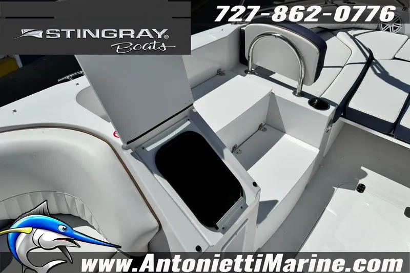 Slide: The Image of 2026 Stingray 212 SC boat interior with seating and storage, featuring Antonietti Marine branding. - 19