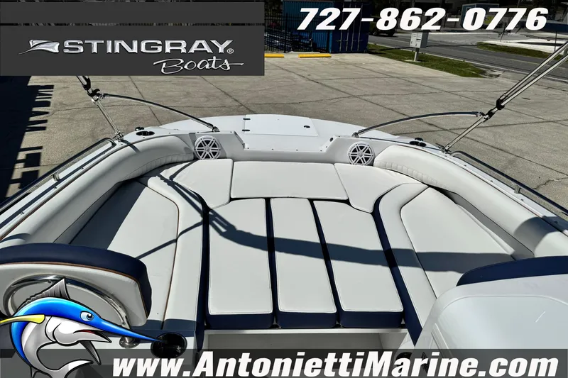 Slide: The Image of 2026 Stingray 212 SC boat interior with seating, displayed at Antonietti Marine. - 21