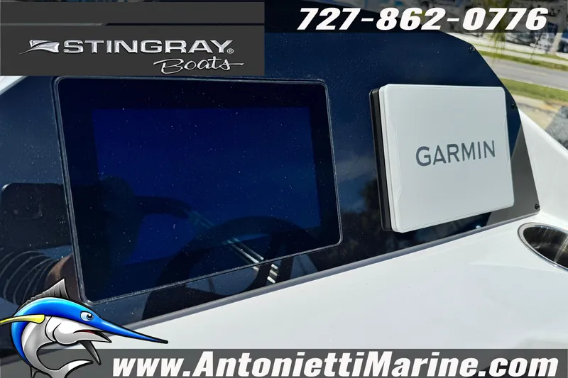 Slide: The Image of 2026 Stingray 212 SC boat dashboard with Garmin display, Antonietti Marine branding. - 25
