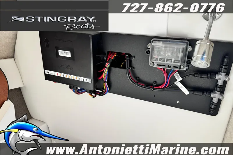 Slide: The Image of Electrical panel of 2026 Stingray 212 SC boat with wiring and controls. - 32