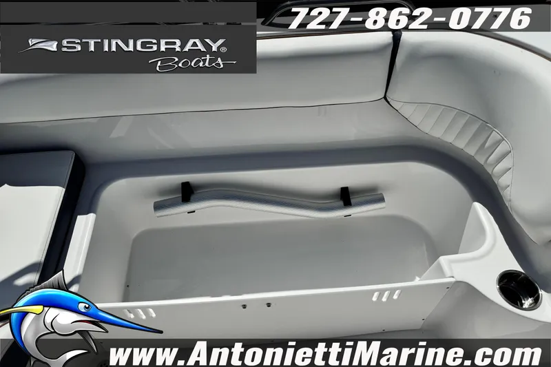 Slide: The Image of 2026 Stingray 212 SC boat interior with seating and storage, featuring Antonietti Marine branding. - 35