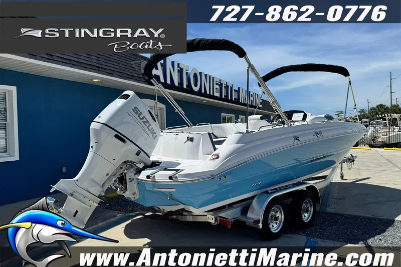Slide: The Image of 2026 Stingray 212 SC boat with Suzuki engine at Antonietti Marine dealership. - 6
