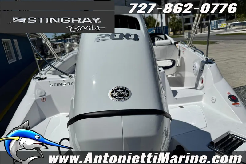 Slide: The Image of 2026 Stingray 212 SC boat displayed at Antonietti Marine dealership. - 7