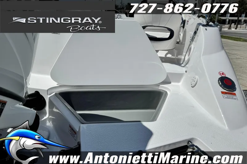 Slide: The Image of 2026 Stingray 212 SC boat interior with seating and storage, featuring Antonietti Marine branding. - 9