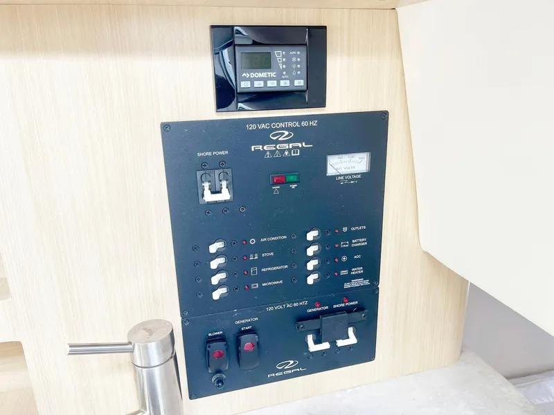 Slide: The Image of Control panel of 2024 Regal 26XO boat with Dometic display and switches. - 15