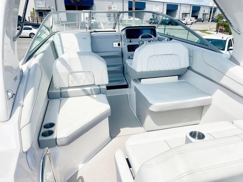 Slide: The Image of 2024 Regal 26XO boat interior with white seating and modern dashboard. - 5