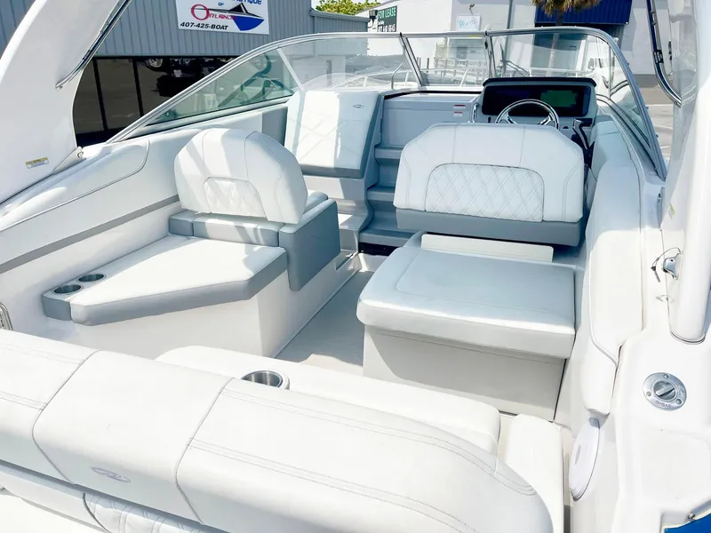 Slide: The Image of 2024 Regal 26XO boat interior with white seating and modern dashboard. - 6