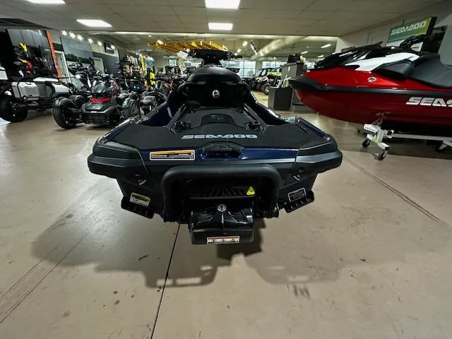 Slide: The Image of 2025 Sea-Doo GTX 230 jet ski in showroom, rear view. - 10