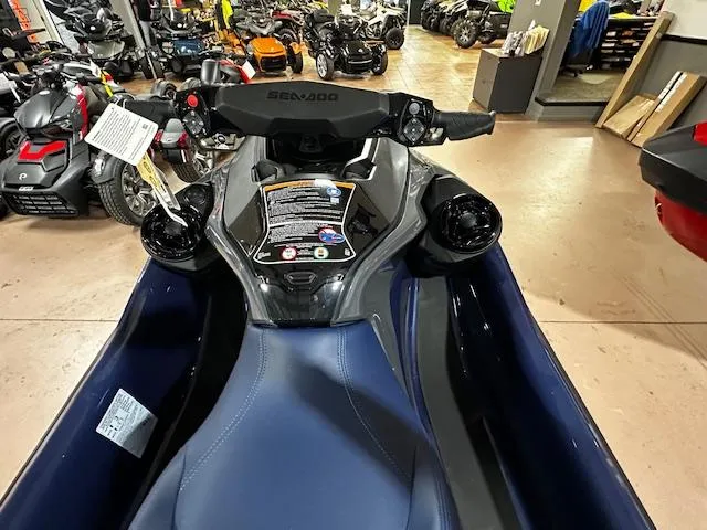 Slide: The Image of 2025 Sea-Doo GTX 230 jet ski in showroom, featuring sleek design and advanced controls. - 13