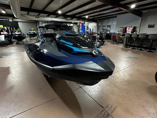 Slide: The Image of 2025 Sea-Doo GTX 230 jet ski displayed in a showroom. - 3