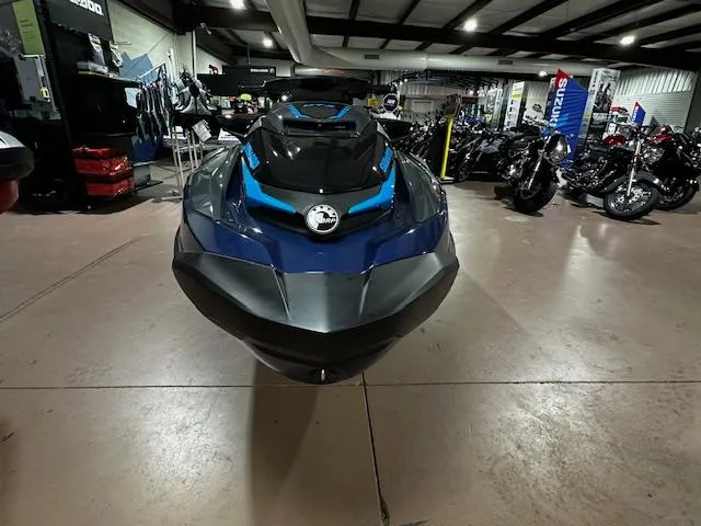 Slide: The Image of 2025 Sea-Doo GTX 230 jet ski displayed in a showroom with motorcycles. - 4