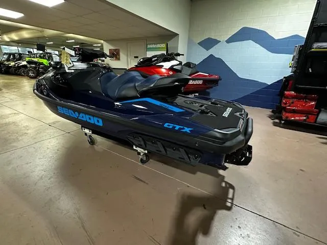 Slide: The Image of 2025 Sea-Doo GTX 230 jet ski displayed indoors, showcasing sleek design and modern features. - 8