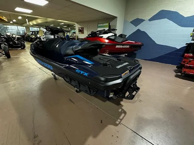 Slide: The Image of 2025 Sea-Doo GTX 230 jet ski displayed in showroom, featuring sleek design and modern features. - 9