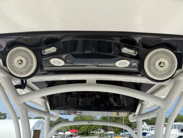 Slide: The Image of 2018 Wellcraft 222 Fisherman boat speakers and lights on T-top. - 13