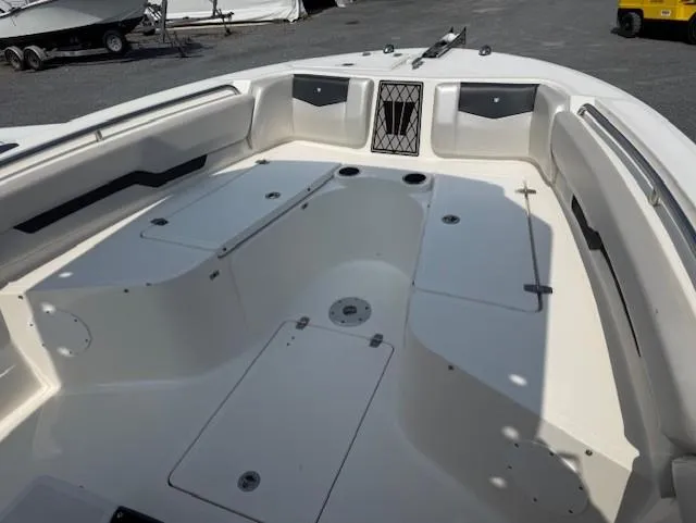 Slide: The Image of 2018 Wellcraft 222 Fisherman boat interior with spacious seating and storage compartments. - 14
